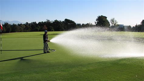 watering greens on golf courses